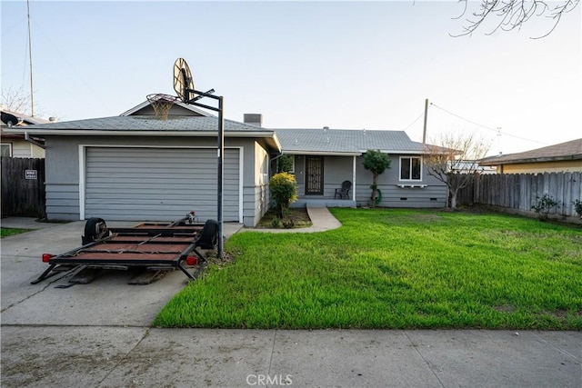 view of front of house featuring a garage and a front yard