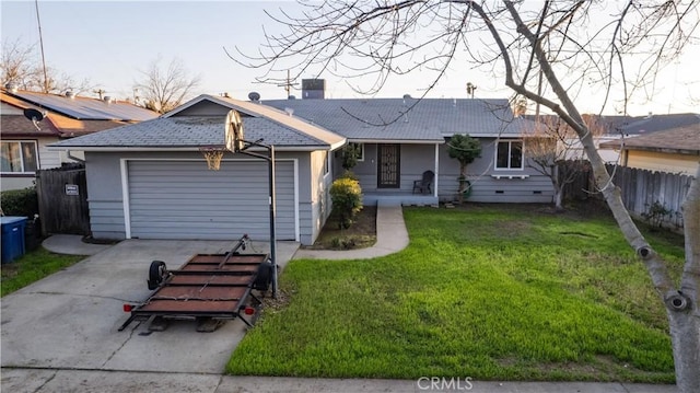 single story home featuring a garage and a front lawn