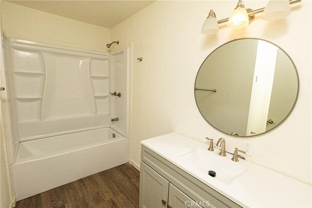 bathroom featuring vanity, wood-type flooring, and shower / tub combination