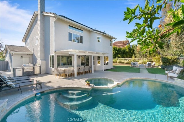 rear view of property featuring a swimming pool with hot tub, a patio, a pergola, and area for grilling