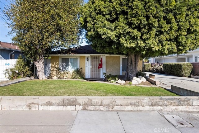 view of front of home with a front yard