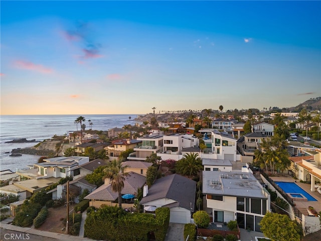 aerial view at dusk with a water view