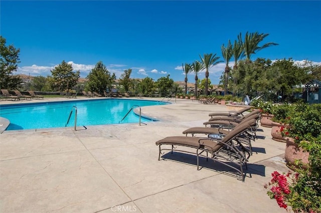 23705 Western Cedar Ct, Valencia, CA 91354 - community pool featuring a patio