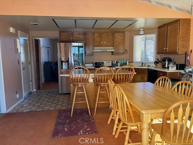 kitchen with sink and appliances with stainless steel finishes