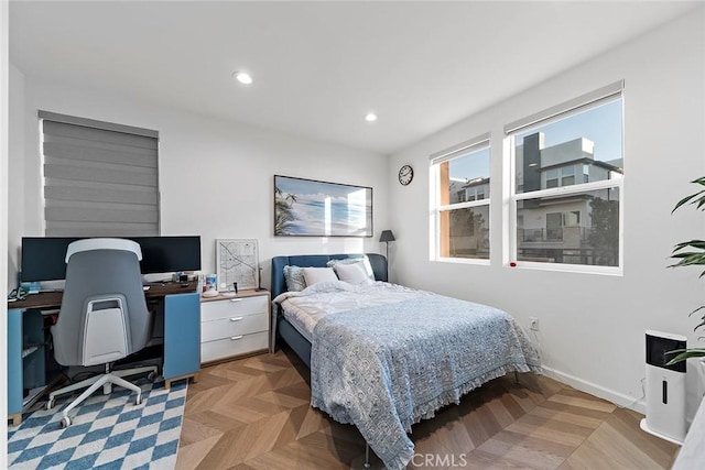 bedroom with light parquet flooring