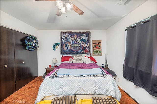 bedroom with ceiling fan and a closet