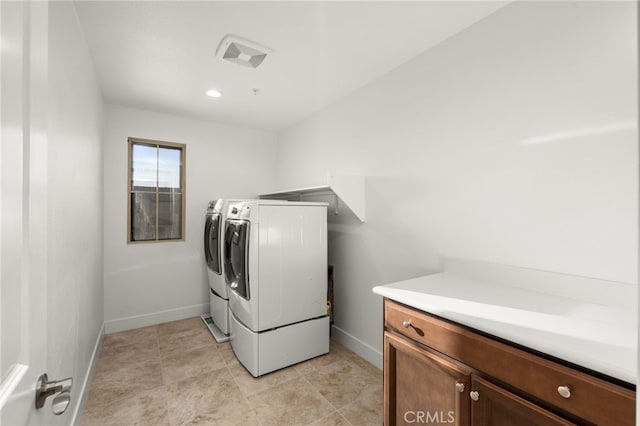 clothes washing area featuring washing machine and clothes dryer