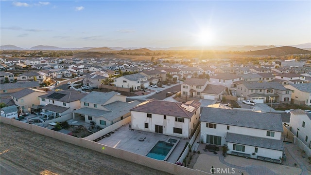 aerial view at dusk with a mountain view