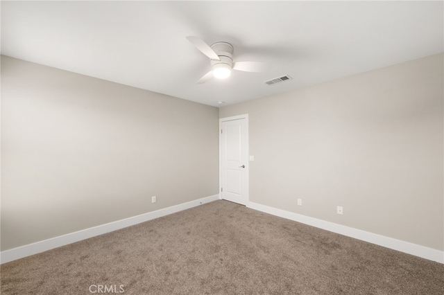 carpeted empty room featuring ceiling fan