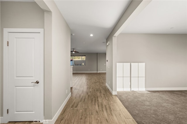 hallway with wood-type flooring