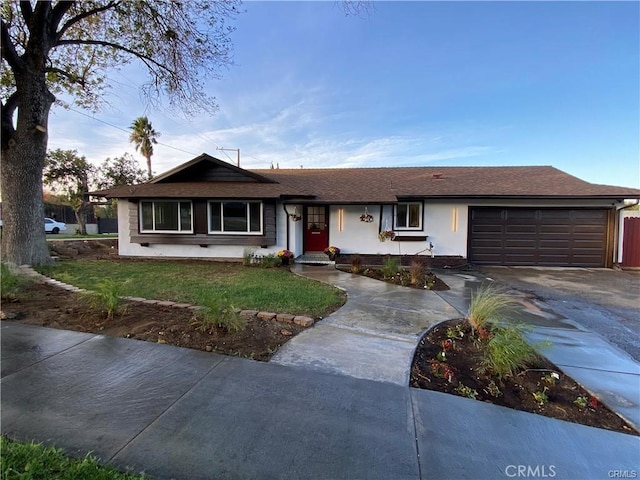 single story home with a garage