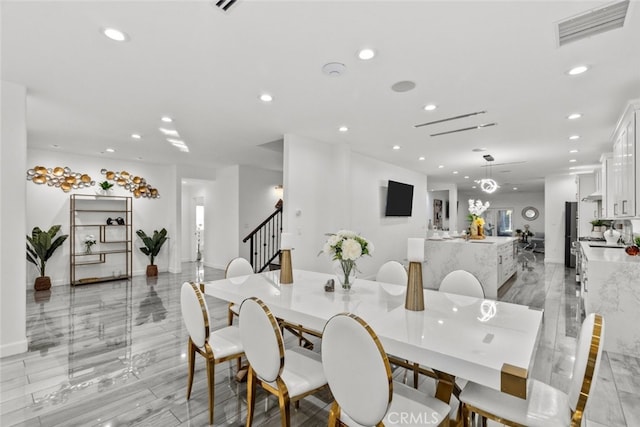 dining room featuring recessed lighting, visible vents, and stairway