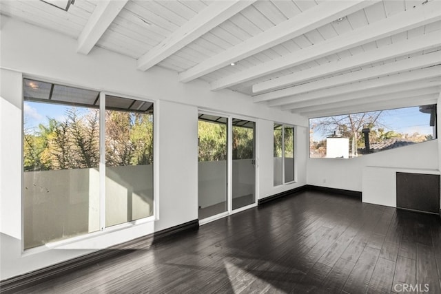 unfurnished sunroom with wooden ceiling and beam ceiling