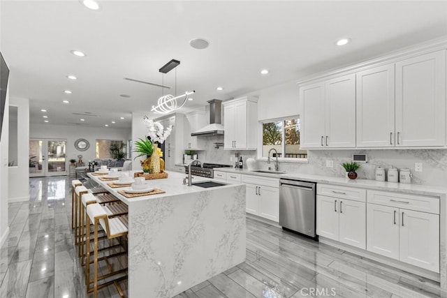 5157 Avenida Oriente, Tarzana, CA 91356 - kitchen with stainless steel dishwasher, wall chimney range hood, a sink, recessed lighting, and tasteful backsplash