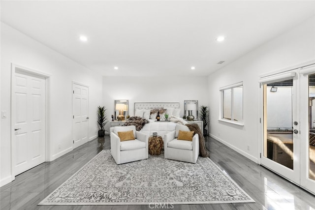 bedroom featuring visible vents, baseboards, wood finished floors, french doors, and recessed lighting