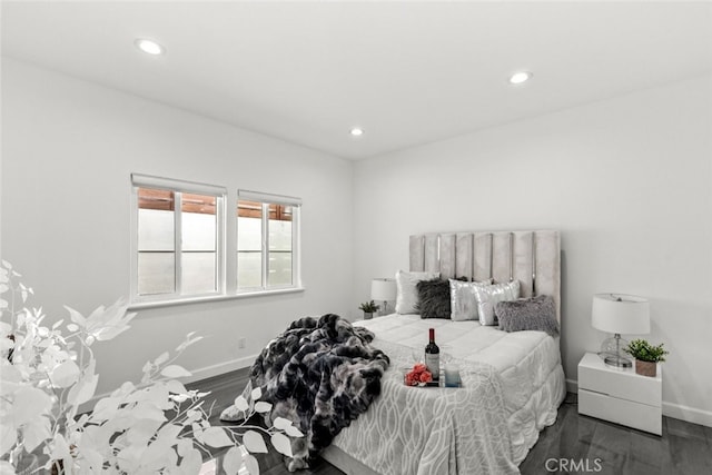 bedroom featuring recessed lighting, baseboards, and wood finished floors