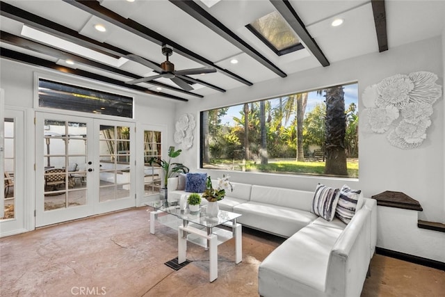 sunroom / solarium featuring ceiling fan, french doors, and beam ceiling