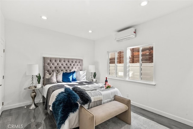 bedroom with recessed lighting, baseboards, an AC wall unit, and wood finished floors