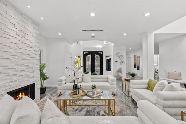 5157 Avenida Oriente, Tarzana, CA 91356 - living room featuring recessed lighting, a stone fireplace, and baseboards
