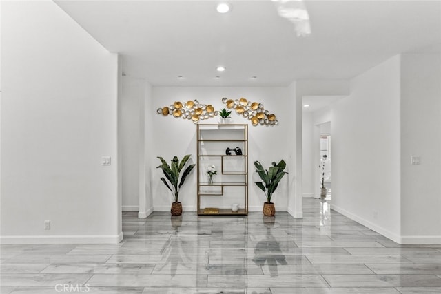 entrance foyer featuring baseboards and recessed lighting