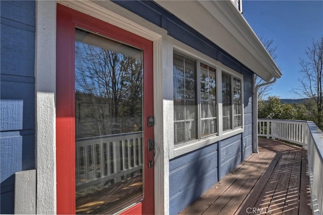 property entrance with a deck