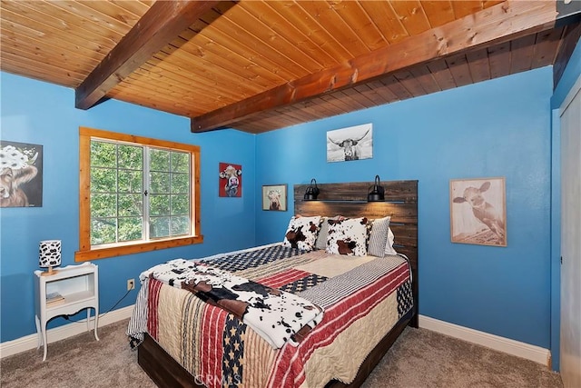 bedroom with beam ceiling, wood ceiling, and carpet floors