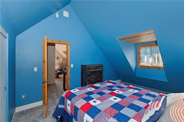 bedroom with vaulted ceiling and carpet