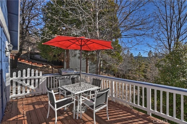 wooden deck featuring grilling area