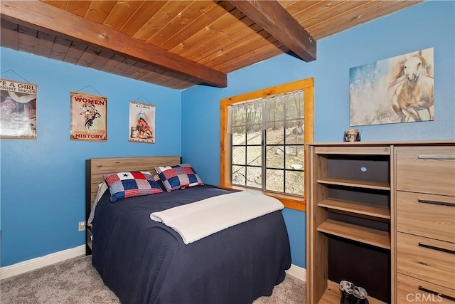 carpeted bedroom with wood ceiling and beam ceiling