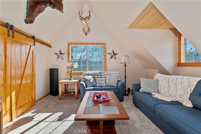 living room with vaulted ceiling, carpet floors, and a barn door