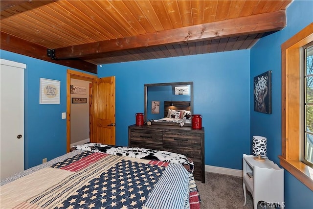 bedroom with beam ceiling, wood ceiling, and carpet