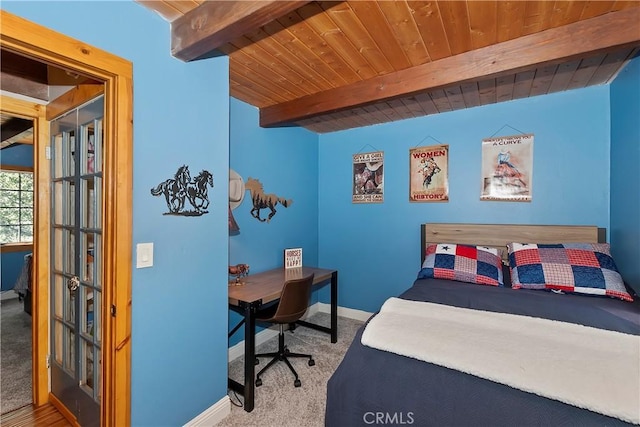 bedroom featuring carpet flooring, beam ceiling, and wood ceiling