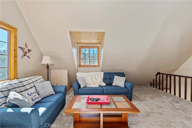 living room with wood ceiling, vaulted ceiling, and carpet floors