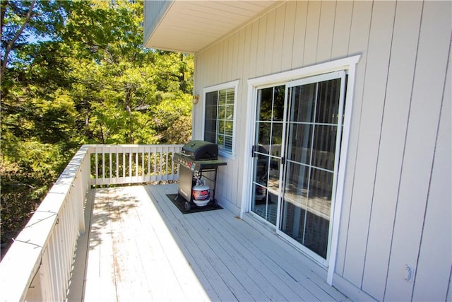 wooden terrace featuring grilling area