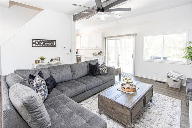 living room featuring ceiling fan and light hardwood / wood-style flooring