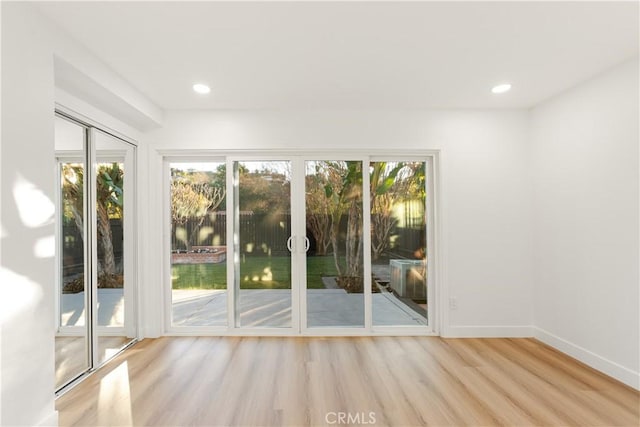 doorway to outside with light hardwood / wood-style floors