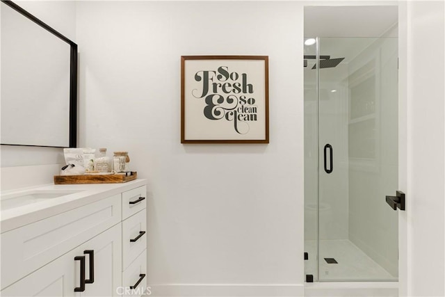 bathroom with vanity and an enclosed shower