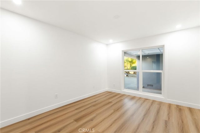 unfurnished room featuring light wood-type flooring