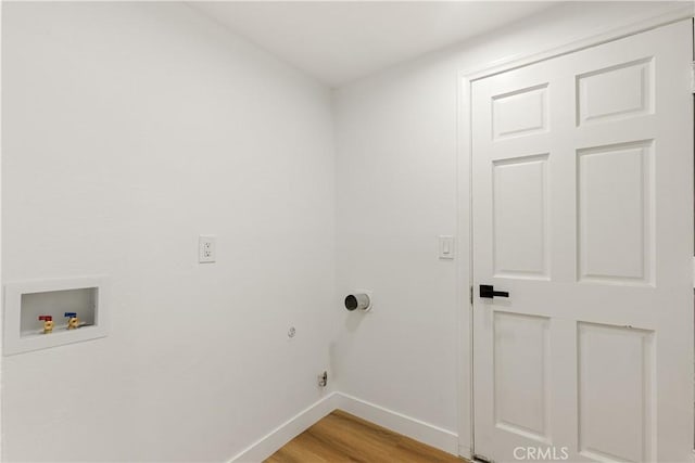 washroom with washer hookup and light wood-type flooring