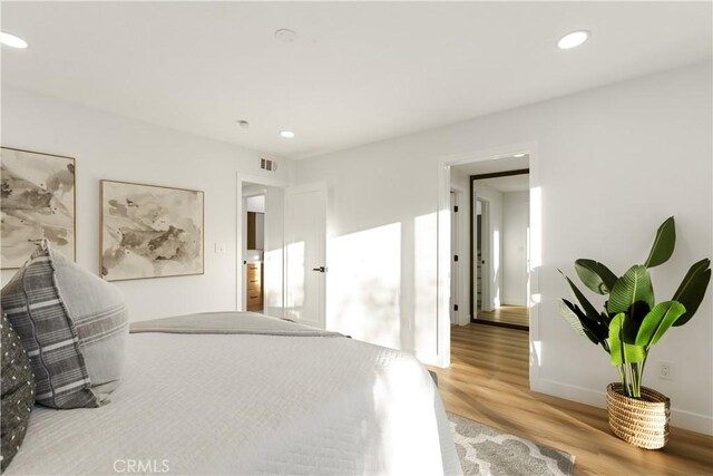 bedroom featuring wood-type flooring