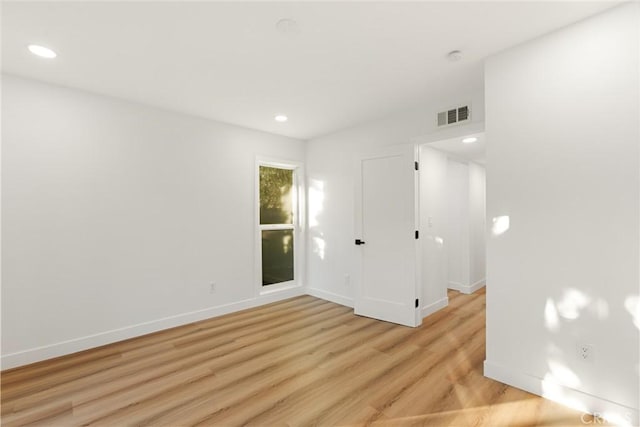 unfurnished room featuring light hardwood / wood-style floors