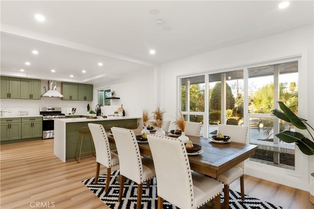 dining room featuring plenty of natural light and light wood-type flooring