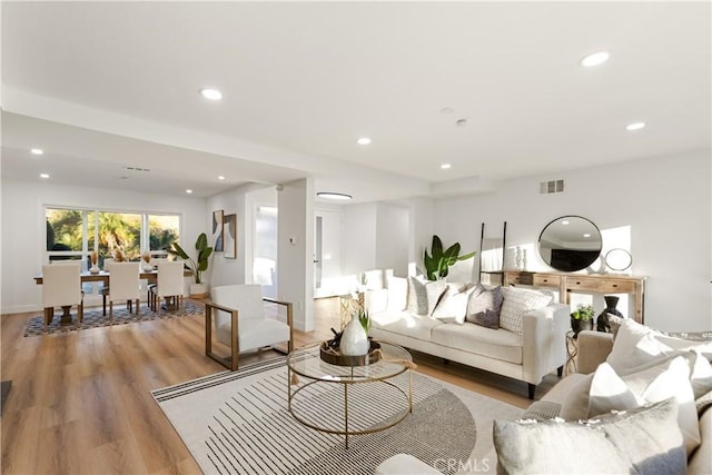 living room with light hardwood / wood-style flooring