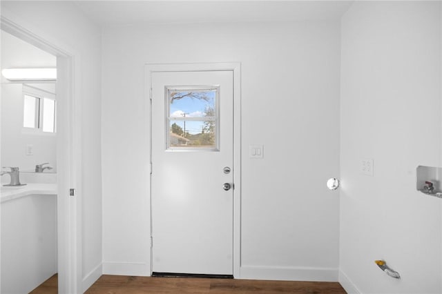 foyer with dark hardwood / wood-style floors