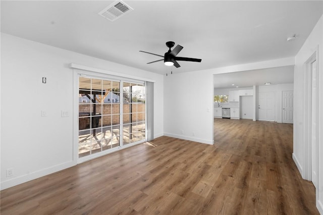 spare room with ceiling fan and hardwood / wood-style floors