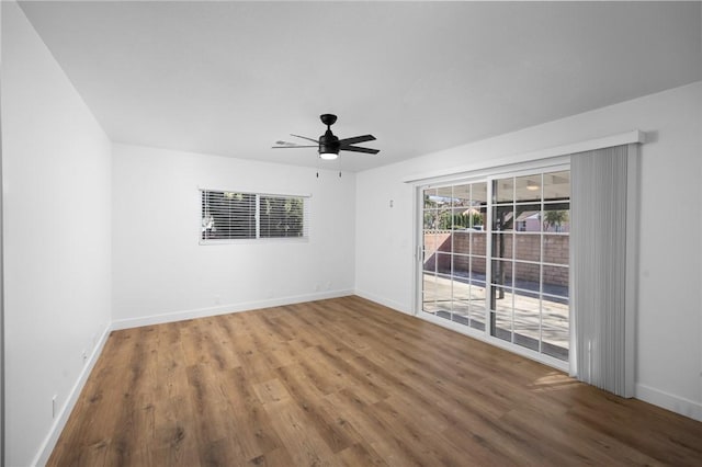 unfurnished room featuring ceiling fan and hardwood / wood-style flooring