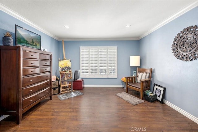 sitting room with dark hardwood / wood-style floors and crown molding