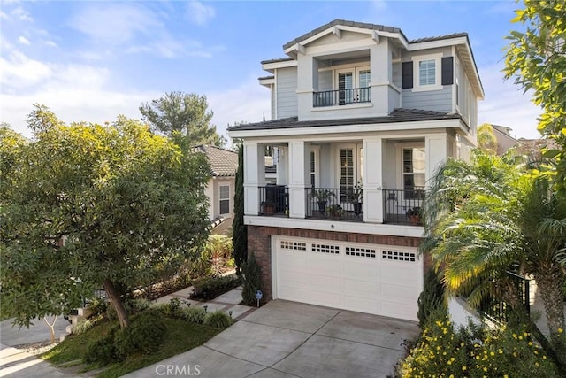 view of front of home with a balcony and a garage