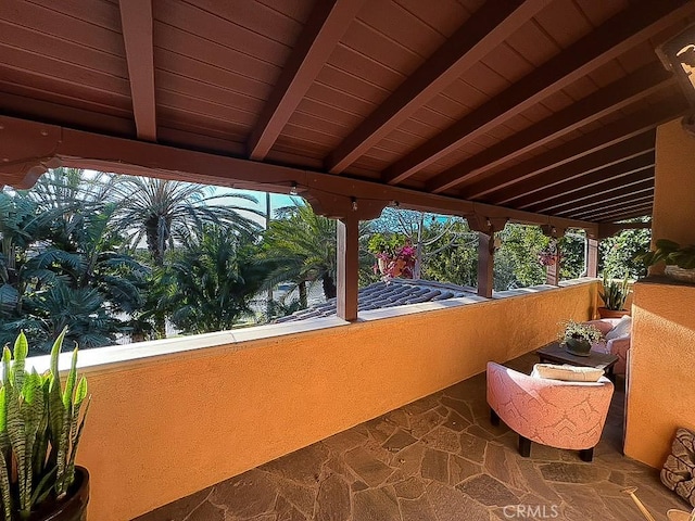 view of patio featuring a balcony