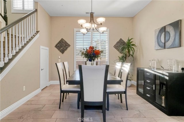 dining space with a chandelier